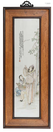 A Chinese polychrome decorated porcelain plaque in a wooden frame, finely painted with a scholar and his servant, with a signed text, 39 x 100 cm (frame)