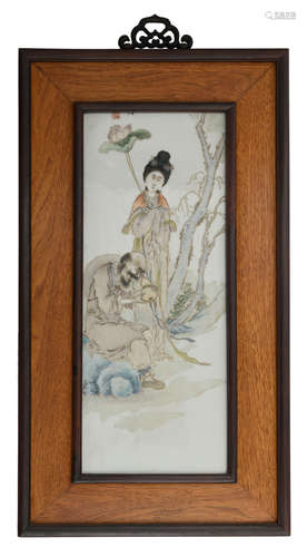 A Chinese polychrome decorated porcelain plaque in a wooden frame, decorated with the Immortals, signed, 39,5 x 72,5 cm (frame)