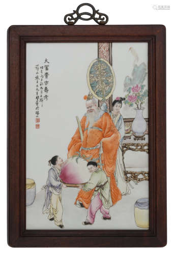 A Chinese polychrome decorated plaque, decorated with two boys presenting a large longevity peach to a dignitary, with a signed text, H 49,5 - W 32,5 cm