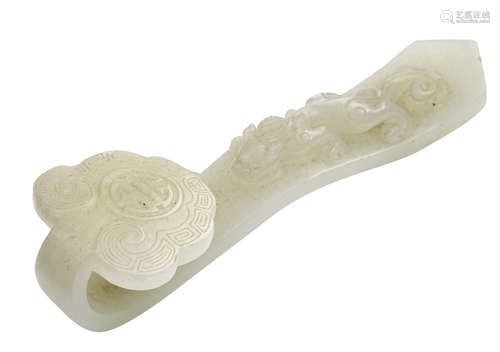 A small Chinese white jadeite belt hook, decorated with a ruyi and a crawling chilong, L 12,3 cm