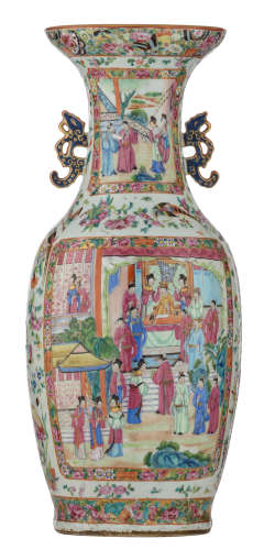 A Chinese Canton famille rose vase with fruits, flowers and butterflies, the roundels decorated with various court scenes with high officials and court ladies, paired with blue glazed dragon handles, H 63 cm