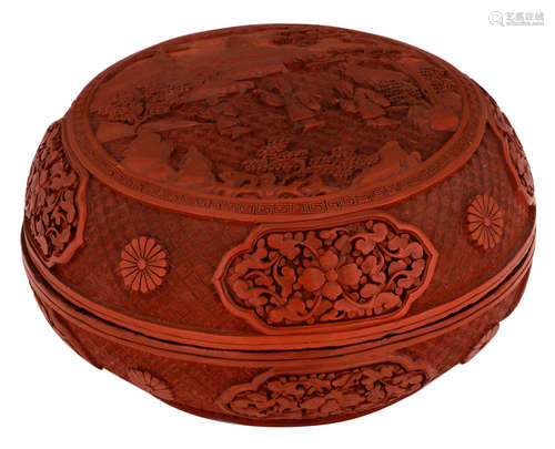 A Chinese carved cinnabar lacquer box and cover, the central roundel of the cover decorated with figures in a mountain landscape, the roundels with a blossom and leafy tendrils, H 12,5 - ø 23 cm