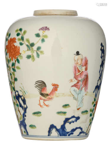 A Chinese Republic period jar, decorated with a boy, playing with a cockerel in a garden setting with blossoming flowers, the reverse with a signed text, H 19,8 cm 