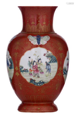 A Chinese famille rose and gilt decorated coral ground begonia shaped vase, the shoulder with butterflies in famille rose, all over with lotus scrolls, flower buds and foliage in gilt, the roundels with playing boys in a garden, with a Jiaqing mark, H 24 cm