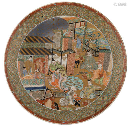 A Japanese 18thC Edo Ko-Imari charger, decorated with literates and ladies in an interior with a garden view, H 8,5 cm - ø 55,5 cm