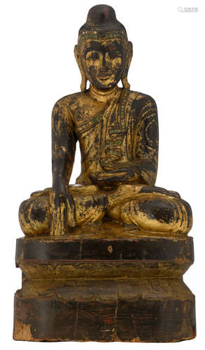 An Oriental gilt bronze seated Buddha on a wooden lotus base, H 50,5 - W 26,5 - D 17 cm