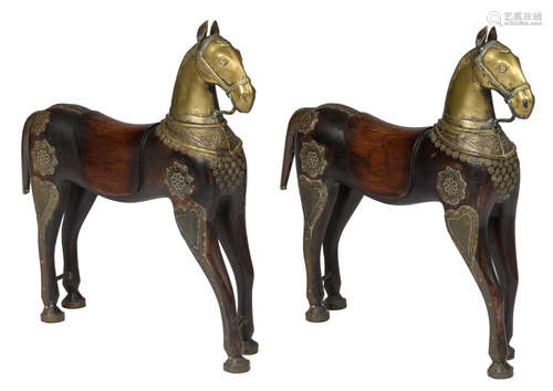 A pair of Oriental wooden horses with brass decoration, H 70 - W 65 cm