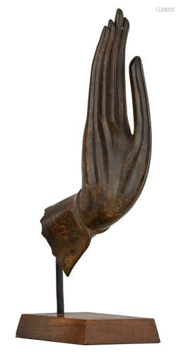 The hand of the Buddha, patinated bronze, attached to a wooden base, H 30,5 (without base) - 38 cm (with base)