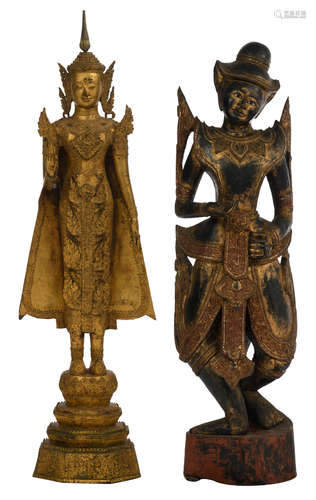 A Thai gilt bronze standing Buddha on a lotus base; added: an Oriental polychrome wooden carved figure, decorated with glass inlay, H 134 - 158 cm