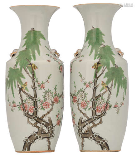 A pair of Chinese famille rose vases, decorated with birds on flower branches, the reverse with butterflies, H 57,5 - 58 cm     