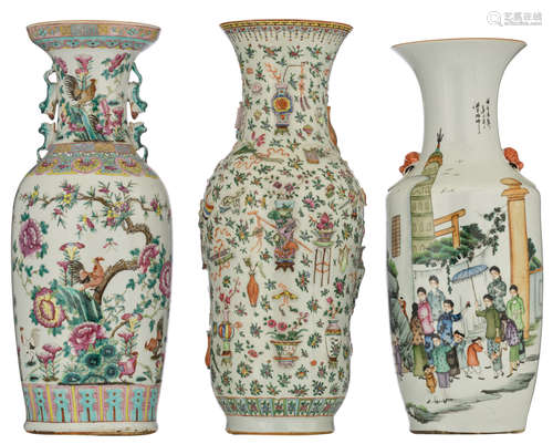 Two Chinese famille rose and polychrome vases, decorated with flowers and flower branches and figures in a village, added: a ditto relief decorated vase with one hundred antiquities, H 57,5 - 60 cm 