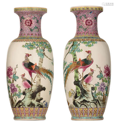 A pair of Chinese Republic period porcelain vases, polychrome decorated with phoenix on a pierced scholar's rock and flower branches, H 60 cm