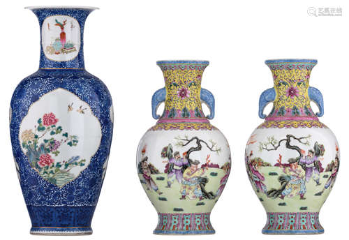 A pair of Chinese Republic period vases, famille rose decorated with a scene of figures, practicing sparring; added: a ditto blue and white vase, the roundels with still lifes and antiquities, H 34 - 44 cm     