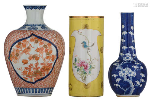 A Chinese blue and white begonia shaped vase, the shoulders with flower balls in underglaze blue, the body iron red and gilt decorated with a pheasant on flower branches, with a Chenghua mark; added: a yellow-ground famille rose cylindrical vase; extra added: a blue and white bottle vase, with a Kangxi mark, H 28 - 31,5 cm   