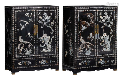 Two Chinese black lacquered cupboards with mother of pearl inlay, decorated with birds and flower branches, H 122 - W 92 - D 48 cm