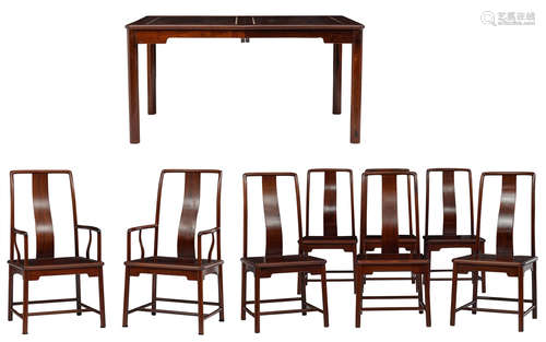 A fine Chinese rosewood extendable dining table with a set of six matching chairs and two ditto armchairs, the table: H 77 - W 151 - 241 (extended) - D 111 cm - the chairs: H 98 - 103 - W 45 - 52 - D 48 cm