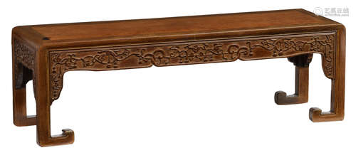 A Chinese richly carved hardwood side table, H 34 - W 108 - D 33 cm