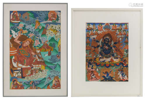 Two Nepalese / Tibetan thangka's, one thangka framed behind matted glass, 39,5 x 61 - framed 51 x 73,5 cm, one thangka framed without glass, 20thC, 33,5 x 46 - framed 56 x 69,5 cm