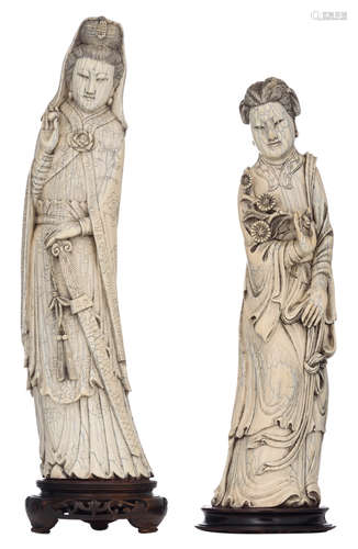 A Chinese ivory Guanyin (possibly mammoth ivory), decorated with black stained engraving, late Qing / first half 20thC, on an exotic wooden base, H 38,9 (without base) - 43,3 cm (with base), total weight 2029 g; added a Chinese ivory beauty on an exotic wooden base, H 36,2 (without base) - 38,2 cm (with base), total weight 1479 gAdded expertise report according to CITES legislation. For European Community use only.