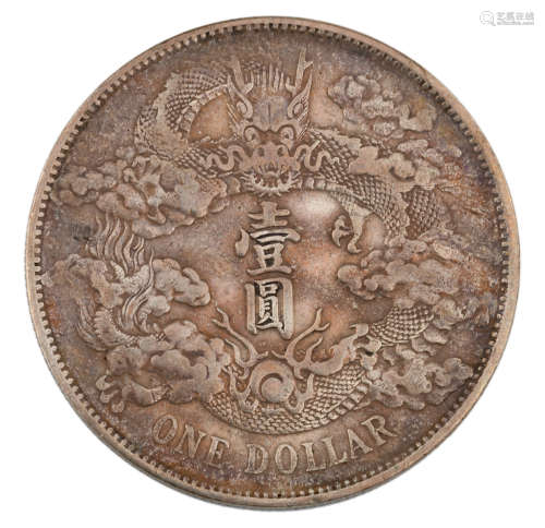 A Chinese ´one dollar´ silver coin, with ´Yi Yuan´, encircled by a dragon, on the front and ´Xuantong 3rd Year´ on the back, ø 3,8cm - weight about 26,8 g