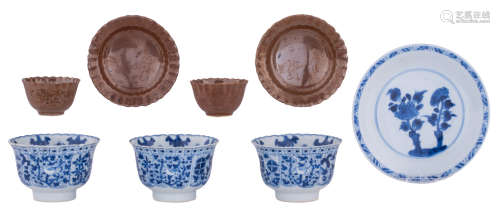 A collection of Chinese Kangxi period porcelain teacups and saucers, consisting of three blue and white floral decorated lobed cups and two iron-brown glazed lobed cups and saucers, some marked Kangxi, H 3,3 - 5,3 - ø 5,7 - 8,2 cm; added: a ditto blue and white saucer, marked Kangxi, ø 13 cm