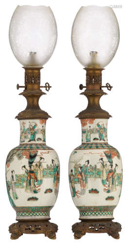 A pair of Chinese famille verte vases, decorated with beauties, playing music in a garden, mounted as a lamp, H 77,5 cm (whole mount)