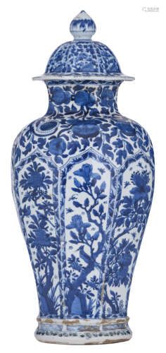 A Chinese blue and white floral decorated baluster shaped vase and cover, the panels decorated with the flower branches, depicting the four seasons, the neck with pomegranates, the cover knob decorated like a lotus bud, H 55 cm