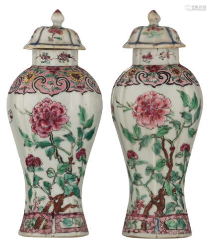 A pair of Chinese famille rose export porcelain vases and covers, decorated with peony flower branches, the shoulders rose ground floral decorated with ruyi lappets, Qianlong period, H 21 cm