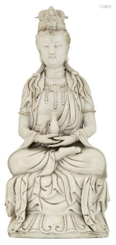 A Chinese Dehua blanc-de-Chine figure of a Guanyin, with jewelled details and a crown, seated cross-legged on a ruyi base with hands, upturned in her lap, holding a bottle, with an impressed He Chaozong seal mark, and a double-gourd seal mark of Dehua, H 36 cm