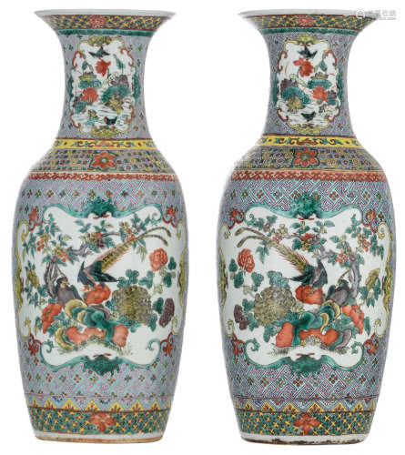 A pair of Chinese turquoise ground and polychrome enamelled baluster shaped vases, the roundels famille verte decorated with peacocks, birds and flowers, encircled with bats, H 57 cm