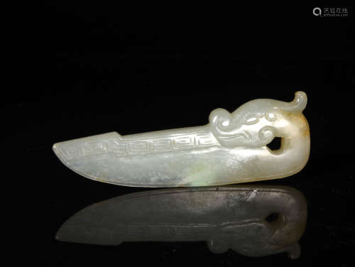 A  QING  DYNASTY   WHITE  JADE    PIN OF  A  FAMILY  HAVING  A  DRAGON