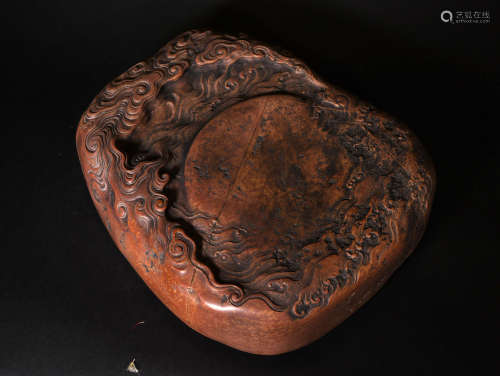 A  QING  DYNASTYRED  SILK  INKSTONE  WITH  SEAWATER  PATTERN