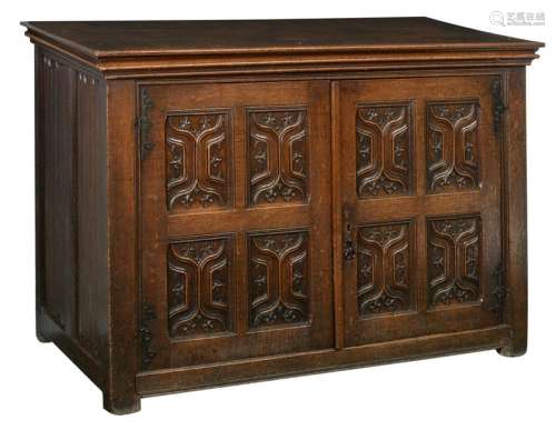 An oak two doors cupboard, the doors set with typical X-pattern cut panels, the sides with linenfold panels, the Southern Netherlands, 17thC, H 112,5 - W 165 - D 75 cm