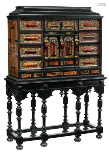 A Flemish Antwerp ebony and ebonized wooden, rosewood, tortoiseshell and faux tortoiseshell veneered cabinet-on-stand, with gilt brass mounts, the central doors enclose a fitted arcaded interior with mirrors and an ivory and rosewood inlaid floor, 17thC, H 91- 174,5 - W 120 - 127 - D 42,5 - 47 cm (without - with stand)Added expertise report according to CITES legislation. For European Community use only.
