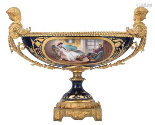 A Sèvres marked neoclassical 'pièce de milieu' with Bleu Royale and gilt ground, the roundels painted with a gallantry scene on the front, and a landscape on the reverse, the inside with floral decoration, gilt bronze mounts, upper glazed mark and year letter U, 20thC, H 42,5 - W 54 - D 29 cm