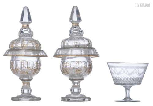 A pair of French cut crystal sweetmeat jars and cover, mid 19thC; added: a French cut and engraved crystal bowl, early 20thC, H 12,5 - 32 - ø 14 - 15,5 cm