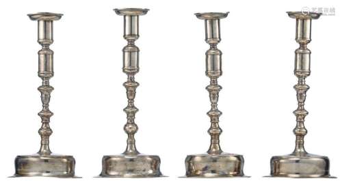 A series of four first half of the 18thC silver candlesticks, no visible hallmarks but with an owners' mark (a crowned double coat of arms), tested on silver purity, H 28 - 29 cm - weight about 1430 g