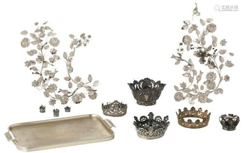 A set of silver crowns fitting for Holy Mother and Child statues, mostly Belgian and French origin, H 2 - 10 cm / ø 2,5 - 18 cm; added: two (18thC) silver foil flower baskets, H 52 cm - weight about 1550 g