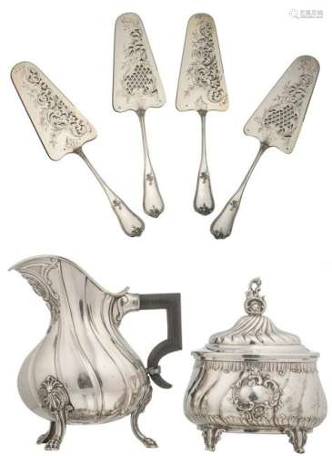 A set of four identical silver cake servers, late 19thC; added: a WMF silver Rococo revival sugar bowl, 20thC; extra added: a German silver Rococo revival creamer with ebony grip, early 20thC, silver purity 800/000, H 15,5 - W 27 cm / weight about 1320 g