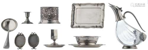 A silver Art Deco saucer and a ditto candlestick, 800/000, total weight: about 800 g, H 6 - 10 - ø 12 - 21 cm; added: a Renaissance-inspired bottle holder, no visible hallmarks but tested on silver purity, total weight: about 220 g, H 10 - ø 13 cm; extra added: a collection of various silver-plated items, consisting of two neoclassical 'porte-photos', a candlestick, an Art Deco ladle, a Rococo inspired tray, and a glass carafe with silver-plated mounts, 20thC, H 7 - 24,5 - 15 x 21,5 cm