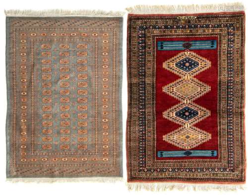 An Oriental rug with geometric motifs; added: an Oriental rug, 127 x 182 / 125,5 x 190,5 cm