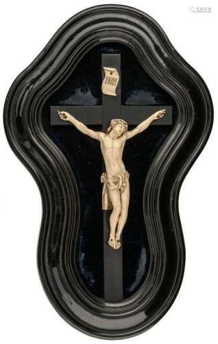 A 19thC Southern Netherlands or French ivory Corpus Christi, with an ebony crucifix and an ebony lacquered period frame, 32,5 x 50 cmAdded expertise report according to CITES legislation. For European Community use only.