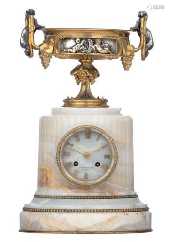 An onyx columnar mantle clock, with on top a gilt and silver plated bronze trophy depicting putti playing with a lion, and decorated with lion shaped handles and hanging grapes, the dial marked 'Barbedienne à Paris', 19thC, H 38 cm