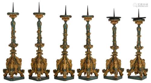 A series of six 18thC polychrome painted and gilt wooden altar candlesticks, H 102 - 111 cm
