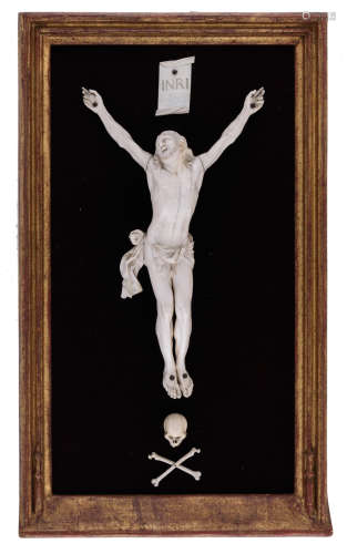 An 18thC ivory Southern Netherlands corpus Christi, complete with the Memento Mori and the 'INRI'-plaque, 20thC framing, 42 x 71 cmAdded expertise report according to CITES legislation. For European Community use only.