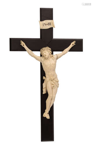 A rare carved ivory corpus Christi, probably Flemish, mounted on an ebony crucifix, the arms carved separately, 18thC, weight (crucifix incl.) about 3.600 g, H 46 - W 33,5 cm (the corpus) - H 80 - W 43,5 cm (the cross)Added expertise report according to CITES legislation. For European Community use only.