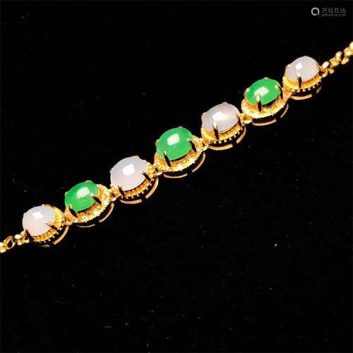 A Chinese Carved Jadeite Bracelet