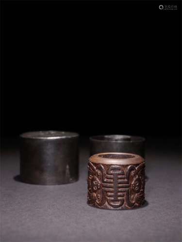 A Chinese Carved Agar-Wood Ring and Case