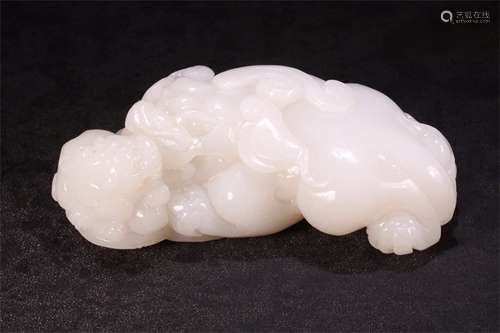 A Chinese Carved Jade Foo-Dog