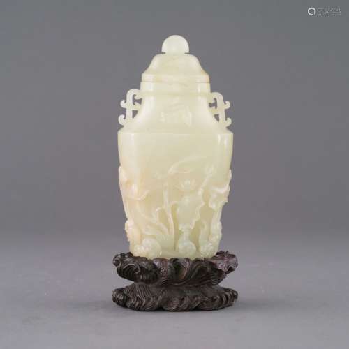 CHINESE JADE LIDDED VASE IN LOTUS RELIEF